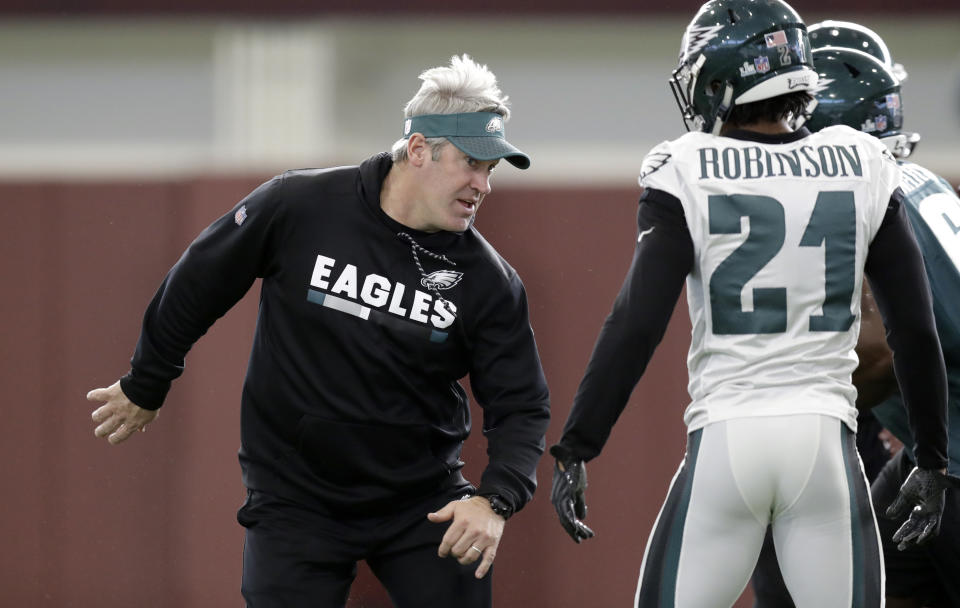 Philadelphia Eagles head coach Doug Pederson, left, works with his players during practice on Thursday. (AP)