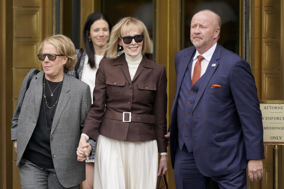 E. Jean Carroll, center, walks out of Manhattan federal court, Tuesday, May 9, 2023, in New York. A jury has found Donald Trump liable for sexually abusing the advice columnist in 1996, awarding her $5 million. / Credit: Seth Wenig / AP