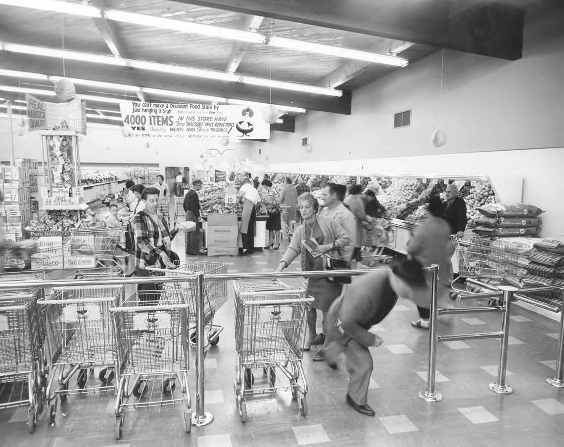 Gov-Mart/Baza’r introduced a new expanded food market in October 1964. Besides food bargains such as bananas at 10 cents a pound, and meats and fresh produce on sale, Gov-Mart put 4,000 food items on price reductions. This photo was originally published in The News Tribune Oct. 13, 1964.