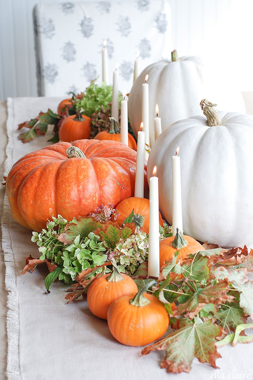 <p>Simple white taper candles add elegance to your fall table decor. </p><p><strong>Get the tutorial at <a rel="nofollow noopener" href="http://www.ellaclaireinspired.com/fall-2015-home-tour/" target="_blank" data-ylk="slk:Ella Claire;elm:context_link;itc:0;sec:content-canvas" class="link ">Ella Claire</a>. </strong></p>