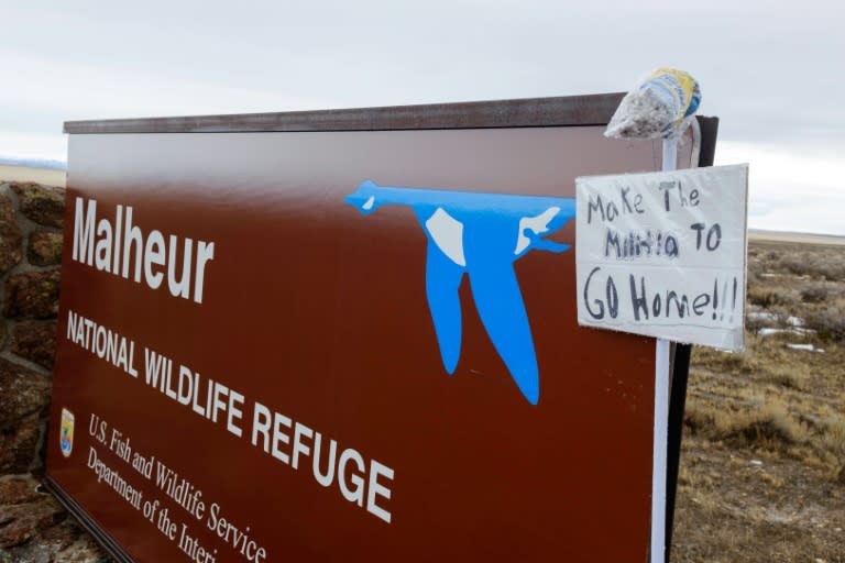 A mop and note are taped to a sign to Malheur National Wildlife Refuge near Burns, Oregon on January 29, 2016