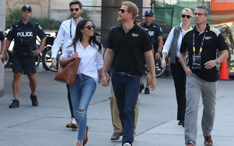 Prince Harry and Meghan Markle attend the Tennis together at the Invictus Games in Toronto - Credit: Splash News