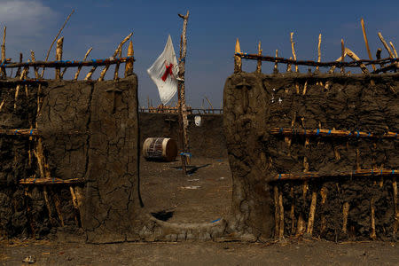 A flag flies inside a local church in the village of Nimini in northern South Sudan, February 8, 2017. REUTERS/Siegfried Modola