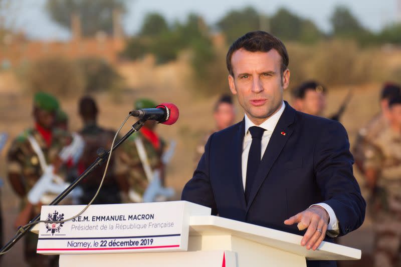 France's President Emmanuel Macron and Niger President Mahamadou Issoufou give a news conference during a ceremony paying homage to Niger soldiers killed in an attack on a military camp which Islamic State claimed responsibility for in Niamey