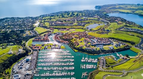 Aerial view of residential suburbs by the harbour in Auckland, New Zealand - Credit: istock