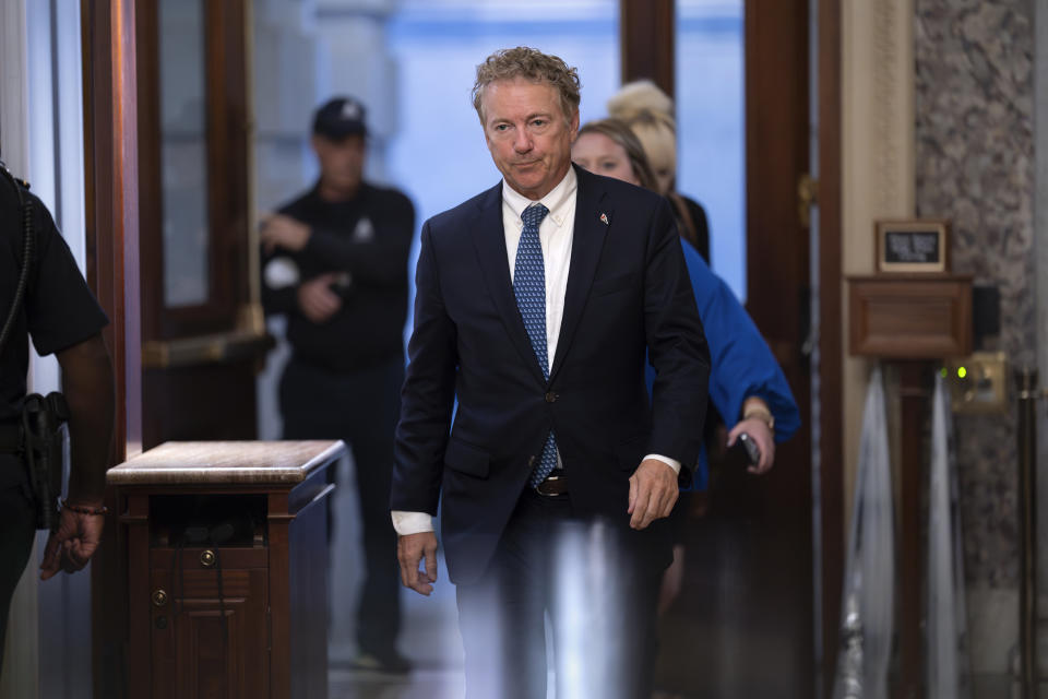 FILE - Sen. Rand Paul, R-Ky., arrives for votes as Congress returns to work in crisis mode with only a few days to go before a government shutdown, at the Capitol in Washington, Tuesday, Sept. 26, 2023. On Friday, Sept. 29, The Associated Press reported on stories circulating online incorrectly claiming aphoto shows Paul sitting on the Capitol steps in a red bathrobe. (AP Photo/J. Scott Applewhite, File)