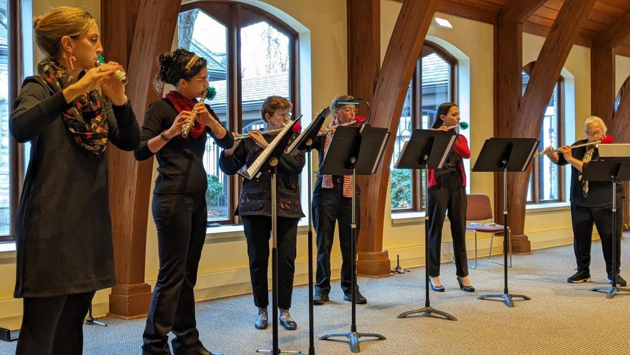 From left, Bloomington Flute Choir members Leighann Ragusa, Amber Mestre, Carolyn Behringer, Deb Wehman, Danielle Priest and Frances Shelly play a piece.