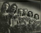 <p>Matching bridesmaids dresses remained popular during this time and off-the-shoulder, ruffled styles, like the ones pictured, were very common. </p>