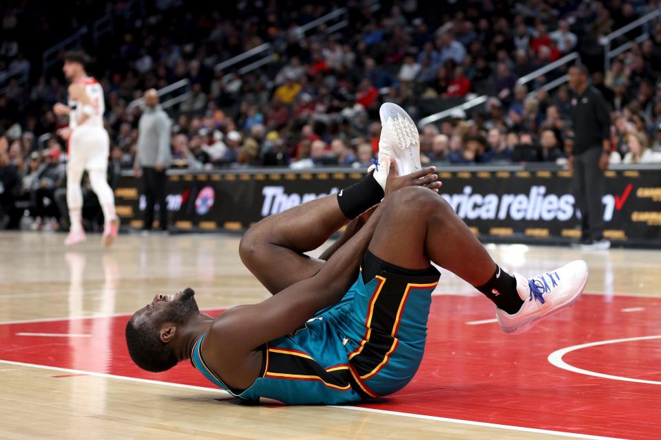 Pistons forward Eugene Omoruyi reacts after being injured in the first half of the Pistons' 117-97 loss to the Wizards on Tuesday, March 14, 2023, in Washington.