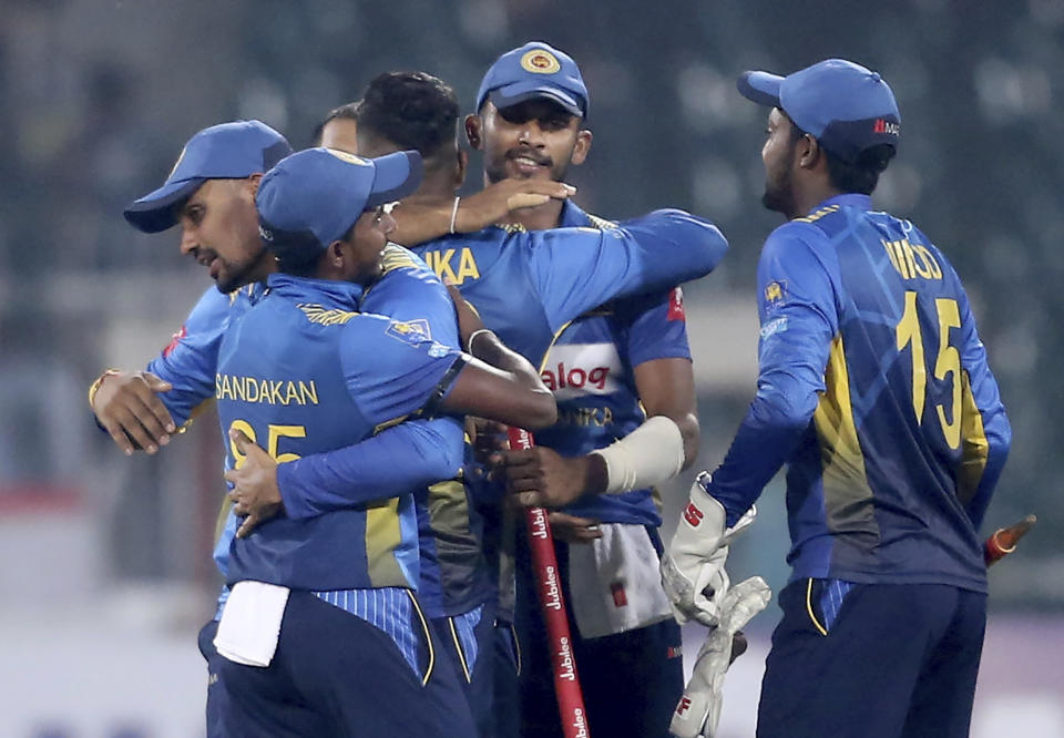 Sri Lankan players celebrate their victory against Pakistan in the second Twenty20 match in Lahore, Pakistan, Monday, Oct. 7, 2019. Sri Lanka's inexperienced team earned another emphatic 35-run victory over top-ranked Pakistan in the second Twenty20 on Monday for an unassailable 2-0 lead in the three-match series.(AP Photo/K.M. Chaudary)