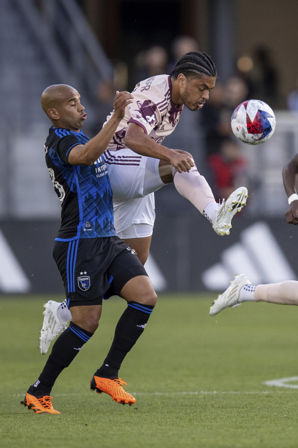 Portland Timbers midfielder Evander, right, gets to the ball next to San Jose Earthquakes midfielder Judson during the first half of an MLS soccer match in San Jose, Calif., Saturday, June 17, 2023. (AP Photo/John Hefti)