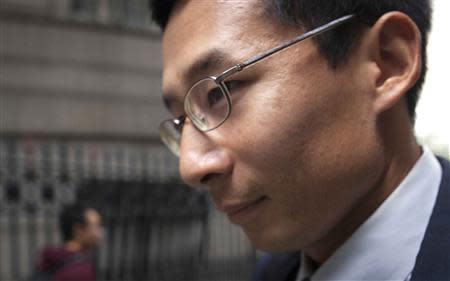 Bob Nguyen, a former employee at expert-networking firm Primary Global Research, leaves court after his sentencing in New York October 17, 2013. REUTERS/Carlo Allegri