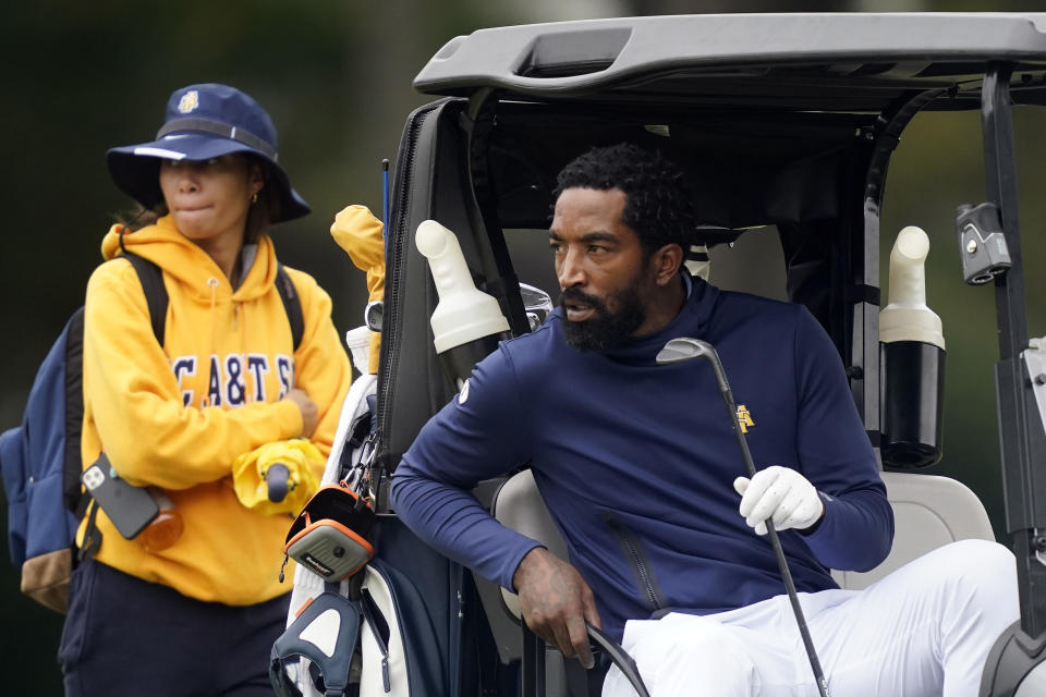 North Carolina A&T's J.R. Smith eyes his next shot on the 17th hole during the first round of the Phoenix Invitational golf tournament in Burlington, N.C., Monday, Oct. 11, 2021. Smith, who spent 16 years in the NBA, made his college golfing debut in the tournament hosted by Elon. (AP Photo/Gerry Broome)