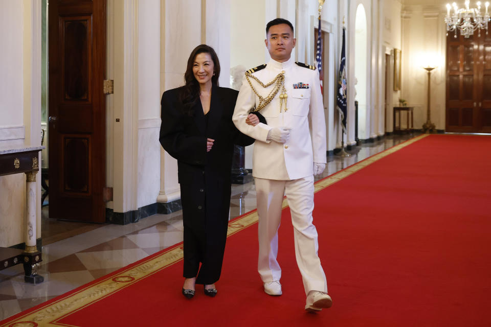 WASHINGTON, DC - MAY 03: Actor Michelle Yeoh is escorted into the East Room before receiving the Medal of Freedom from U.S. President Joe Biden at the White House on May 3, 2024 in Washington, DC. President Biden awarded the Presidential Medal of Freedom, the Nation’s highest civilian honor, to 19 individuals including political leaders, civil rights icons and other influential cultural icons. (Photo by Kevin Dietsch/Getty Images)