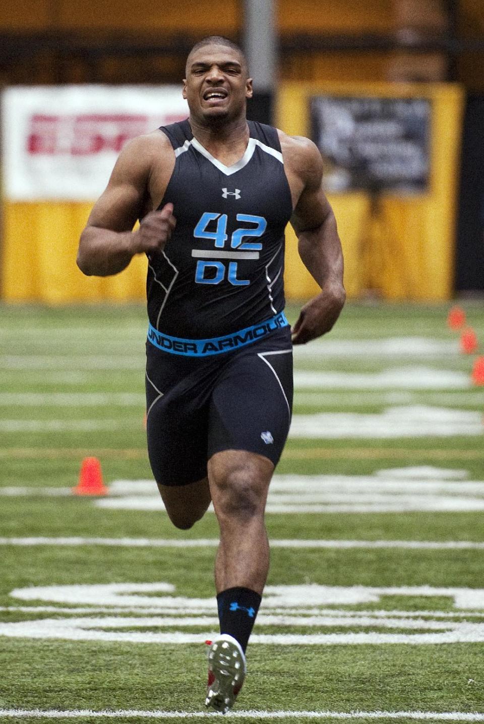 Missouri defensive lineman Michael Sam crosses the finish line while running the 40-yard dash during pro day for NFL football representatives Thursday, March 20, 2014, in Columbia, Mo. (AP Photo/L.G. Patterson)