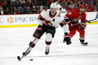 Ottawa Senators' Thomas Chabot (72) skates with the puck after taking it away from Carolina Hurricanes' Ian Cole (28) during the first period of an NHL hockey game in Raleigh, N.C., Thursday, Dec. 2, 2021. (AP Photo/Karl B DeBlaker)