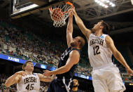 GREENSBORO, NC - MARCH 16: Kenny Frease #32 of the Xavier Musketeers dunks on Alex Dragicevich #12 of the Notre Dame Fighting Irish in the first half during the second round of the 2012 NCAA Men's Basketball Tournament at Greensboro Coliseum on March 16, 2012 in Greensboro, North Carolina. (Photo by Mike Ehrmann/Getty Images)