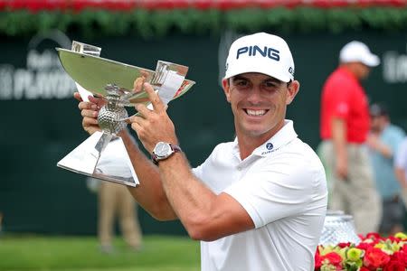 Sep 14, 2014; Atlanta, GA, USA; Billy Horschel holds up the FedEx Cup after the final round of the Tour Championship at East Lake Golf Club. Mandatory Credit: Jason Getz-USA TODAY Sports