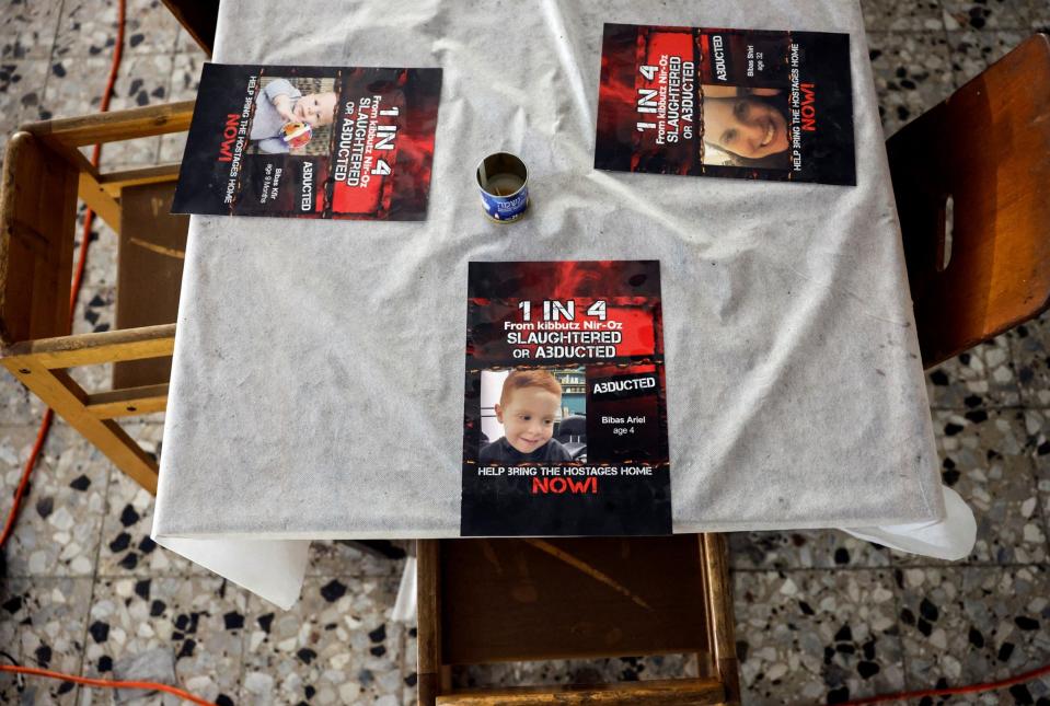 Kibbutz Nir Oz marked their Seder table with images of hostages still held by Hamas in the Gaza Strip