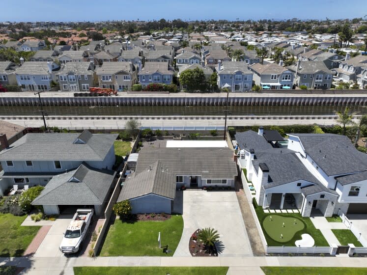 Huntington Beach, CA - April 22: A view of a home for sale at center of photo, 20821 Catamaran Ln. in Huntington Beach, listed at $1,199,000 Friday, April 22, 2022. The median home price in Orange Count has reached $1 million for the first time in history. (Allen J. Schaben / Los Angeles Times)