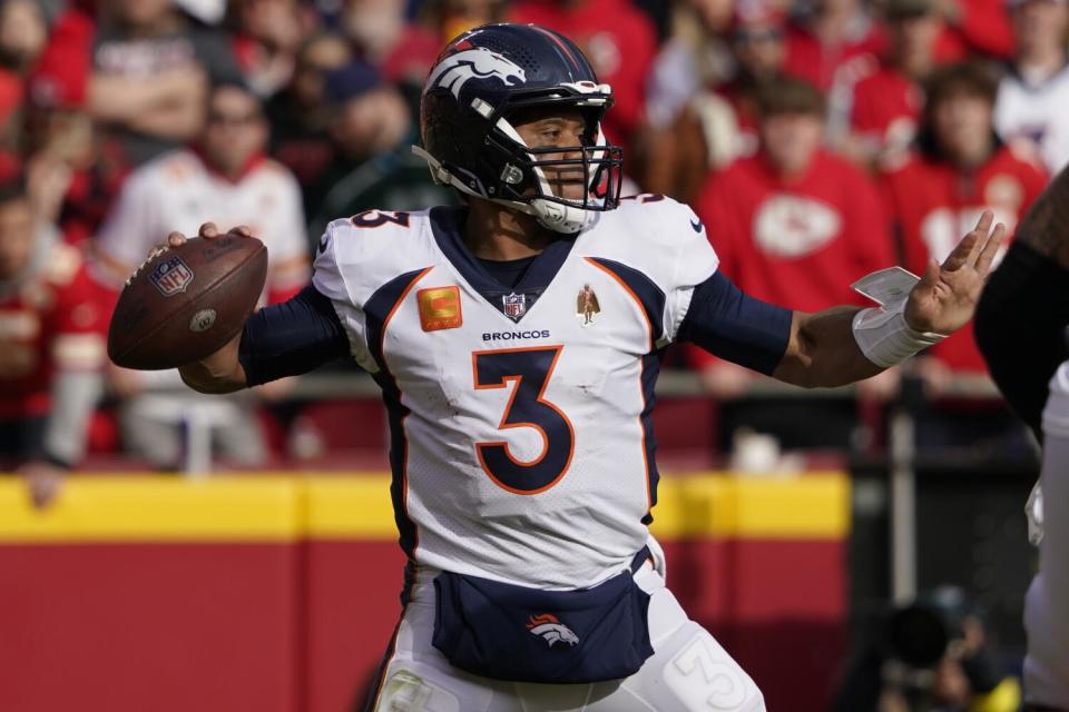 Broncos quarterback Russell Wilson looks to pass against the Chiefs.