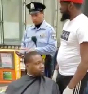 Man giving homeless haircuts nearly gets shut down by police. (Photo: Twitter)