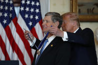 President Donald Trump speaks presents the Presidential Medal of Freedom to Jim Ryun, in the Blue Room of the White House, Friday, July 24, 2020, in Washington. (AP Photo/Alex Brandon)