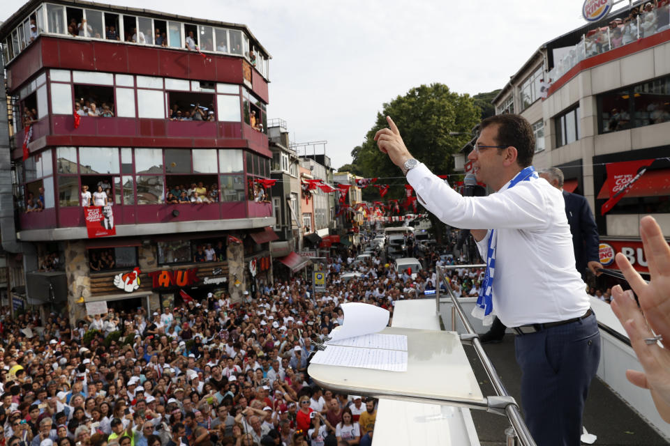 FILE - In this Friday, June 21, 2019 file photo, Ekrem Imamoglu, candidate of the secular opposition Republican People's Party, or CHP, waves to supporters during a rally in Istanbul, ahead of the June 23 re-run of Istanbul elections.Voters in Istanbul return to the polls on Sunday for a rerun of the election for the mayor of the city. (AP Photo/Lefteris Pitarakis, File)