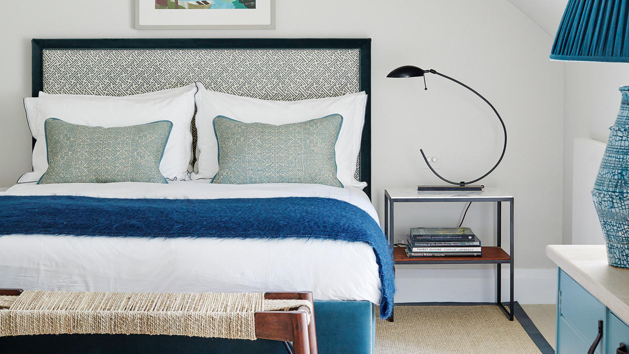  bedroom with blue and white bedding 