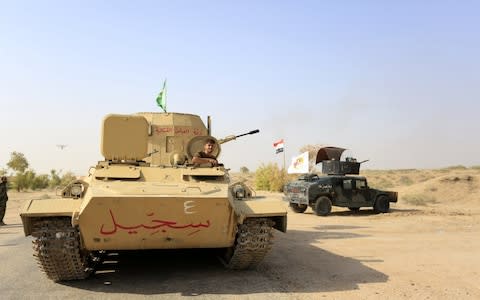 Members of Iraqi Shiite militia Imam Ali Brigades for battle to take Tal Afar - Credit: Khider Abbas/EPA