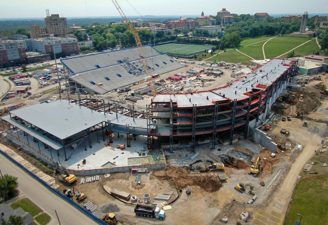 Construction crews continue work on David Booth Kansas Memorial Stadium, home of the KU Jayhawks’ football team, on Thursday, July 25, 2024, in Lawrence. Crews are completely rebuilding the west side of the stadium, which should be complete in time for the start of the 2025 football season. A conference center is being added to the north bowl of the stadium.