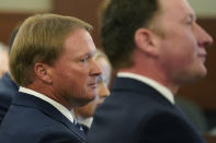 Jon Gruden listens in court Wednesday, May 25, 2022, in Las Vegas. A Nevada judge heard a bid Wednesday by the National Football League to dismiss former Las Vegas Raiders coach Jon Gruden's lawsuit accusing the league of a "malicious and orchestrated campaign" including the leaking of offensive emails ahead of his resignation last October. (AP Photo/John Locher)