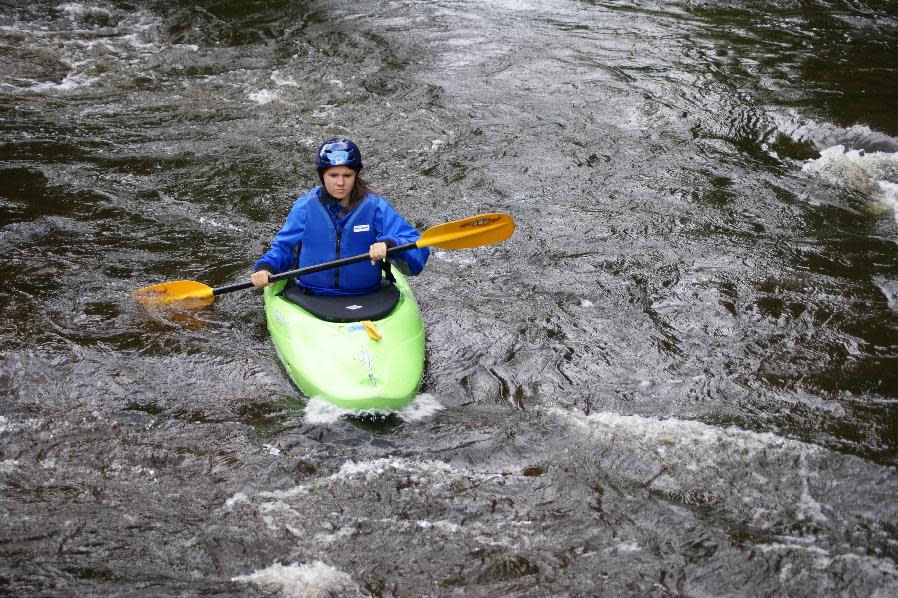 In this undated photo provided by Tammy Welles, Boy Scouts’ Venturing crew member Jenny Welles kayaks on the Wolf River near White Lake, Wis. For the first time, members of Venturing crews, including girls, will be allowed to participate in the Boy Scouts national jamboree being held in mid-July in Glen Jean, W.Va. (AP Photo/Tammy Welles)