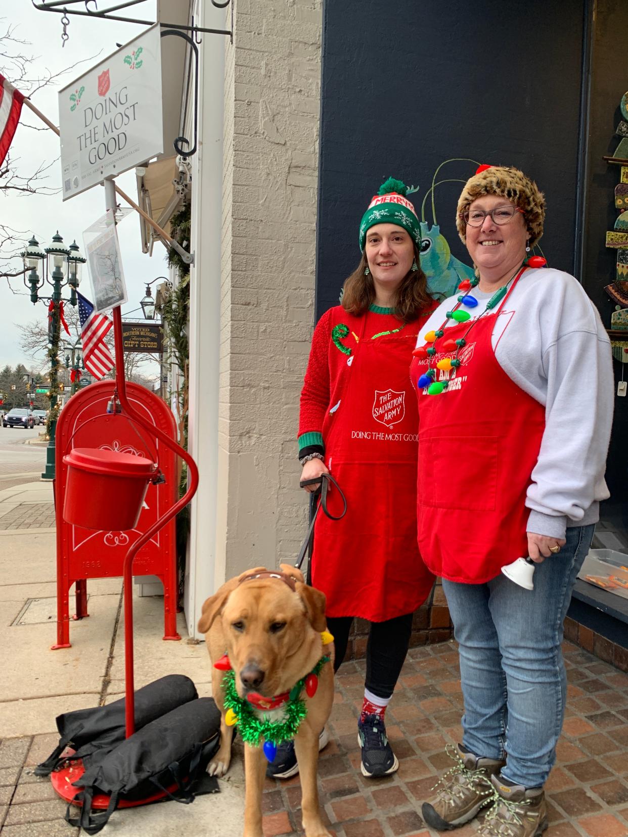 Amanda Labarge (left) and Robyn Rakoniewski worked as bell ringers in downtown Petoskey Dec. 16.