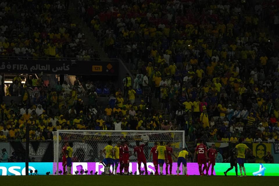 Lights of the stadium are off during the World Cup group G football match between Brazil and Switzerland, at the Stadium 974 in Doha, Qatar, Monday, Nov. 28, 2022. (AP Photo/Ariel Schalit)