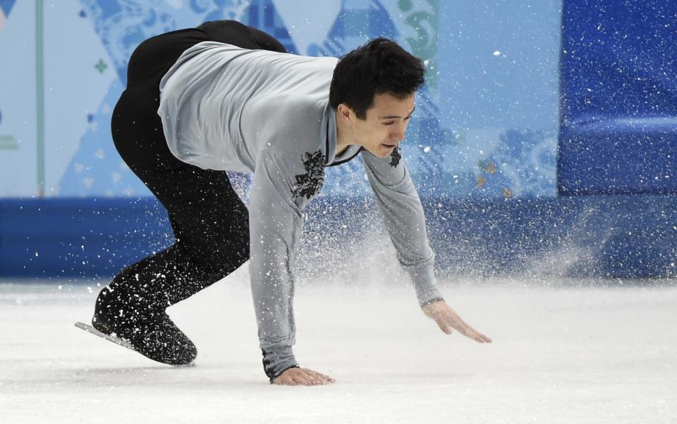 Canada's Patrick Chan falls while landing a jump during the men's free skate figure skating final at the Iceberg Skating Palace during the 2014 Winter Olympics, Friday, Feb. 14, 2014, in Sochi, Russia (AP Photo/The Canadian Press, Paul Chiasson)