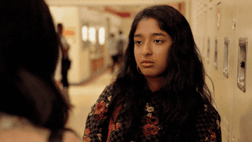 GIF from "Never Have I Ever" of a girl rolling her eyes and turning around