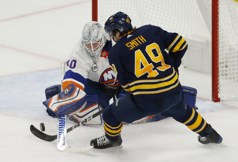 Buffalo Sabres forward C.J. Smith (49) is stopped by New York Islanders goalie Robin Lehner (40) during the third period of an NHL hockey game, Monday, Dec. 31, 2018, in Buffalo N.Y. (AP Photo/Jeffrey T. Barnes)