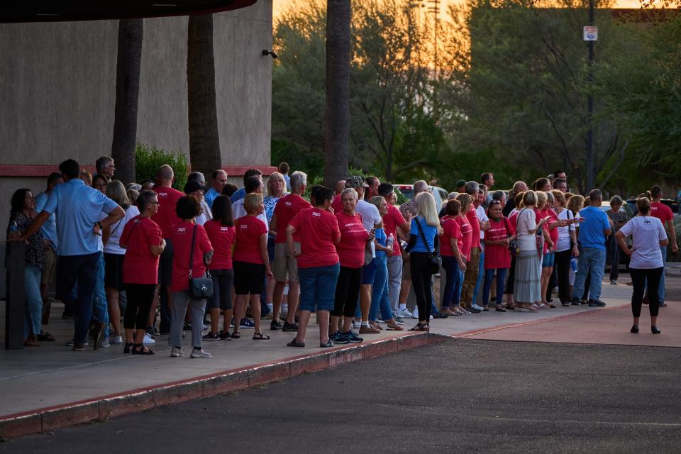 The crowd of attendees waits outside the Arizona Broadway Theatre for the Peoria Mayoral Debate on Oct. 5, 2022.