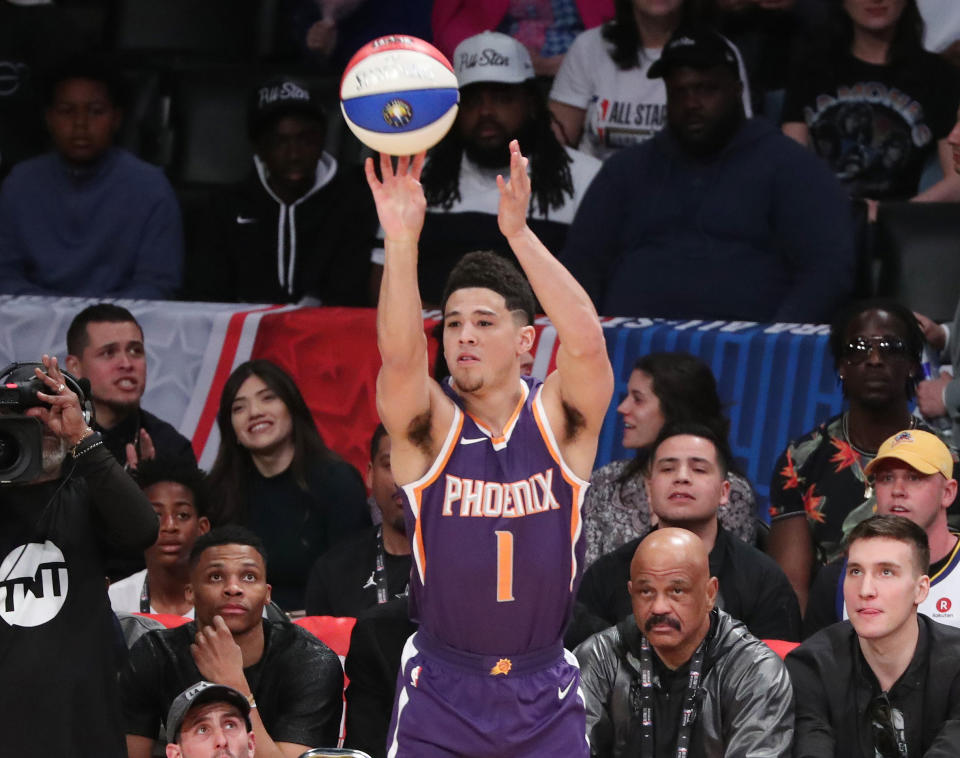 Phoenix Suns guard Devin Booker strokes the money ball. (Getty)