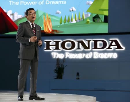 Takahiro Hachigo, President and CEO, Honda Motor Co., speaks during the North American International Auto Show in Detroit, Michigan, U.S., January 9, 2017. REUTERS/Brendan McDermid