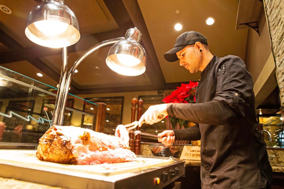 Tony Warder, chef de cuisine, slices a prime rib in Wilmington, Tuesday, Dec. 19, 2023. Open since 1988, Harry's Savoy Grill was named one of USA Today Restaurants of the Year 2024 and is known for its prime rib and creme brûlée.