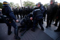 French riot police clash with demonstrators after partial results in the first round of 2017 French presidential election, in Paris, France April 23, 2017. REUTERS/Jean-Paul Pellisier