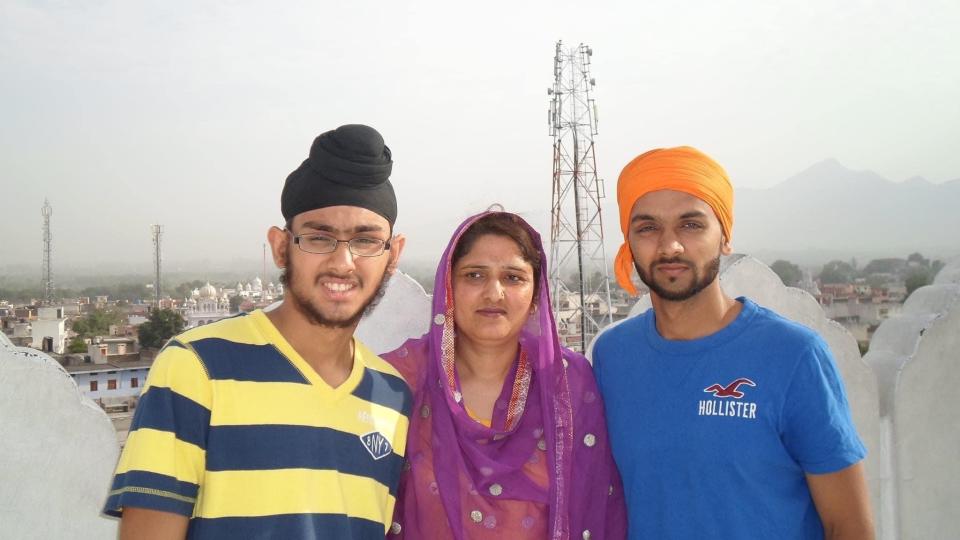 Harpreet Singh Saini, left, with his mother, Paramjit Kaur Saini, and his brother, Kamal Singh Saini, in 2012. That Aug. 5, in Oak Creek, Wisconsin, a gunman invaded their Sikh temple and killed six worshipers, including his mother.