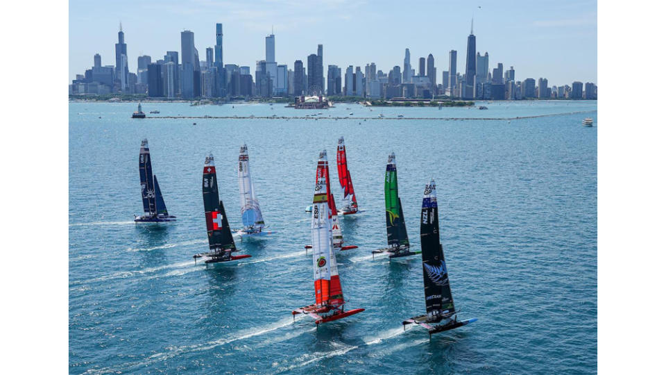 The fleet offshore in Lake Michigan. Light winds prompted the boats to have their largest 95-foot-tall wingsails. - Credit: Courtesy SailGP