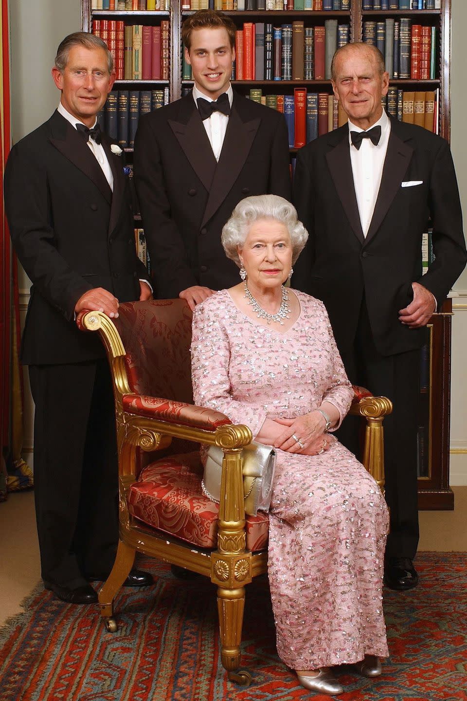 <p>For this official portrait, the queen wore an embellished pink gown with her husband, their son, Prince Charles, and grandson Prince William at Clarence House.</p>