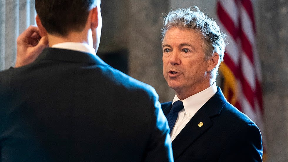 Sen. Josh Hawley (R-Mo.) listens to Sen. Rand Paul (R-Ky.) outside the Senate Chamber during a vote regarding a nomination on Thursday, December 2, 2021.