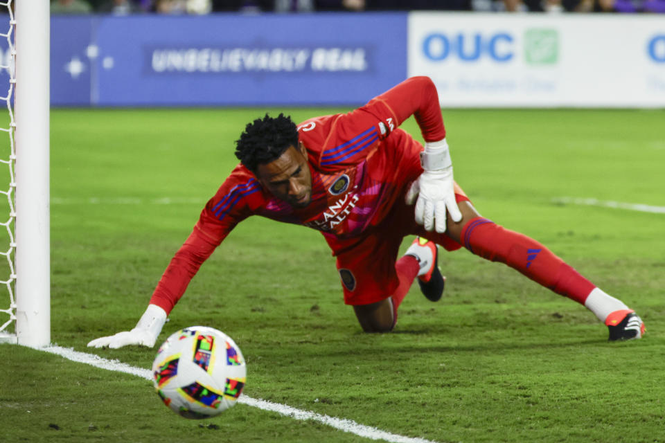 Orlando City goalkeeper Pedro Gallese stops the ball kicked by CF Montréal during the first half of an MLS soccer match Saturday, Feb. 24, 2024, in Orlando, Fla. (AP Photo/Kevin Kolczynski)