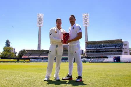 Australian cricket team captain Steve Smith stands with South Africa's captain Faf du Plessis as they hold the series trophy at the WACA Ground in Perth, Australia, November 2, 2016. REUTERS/David Gray