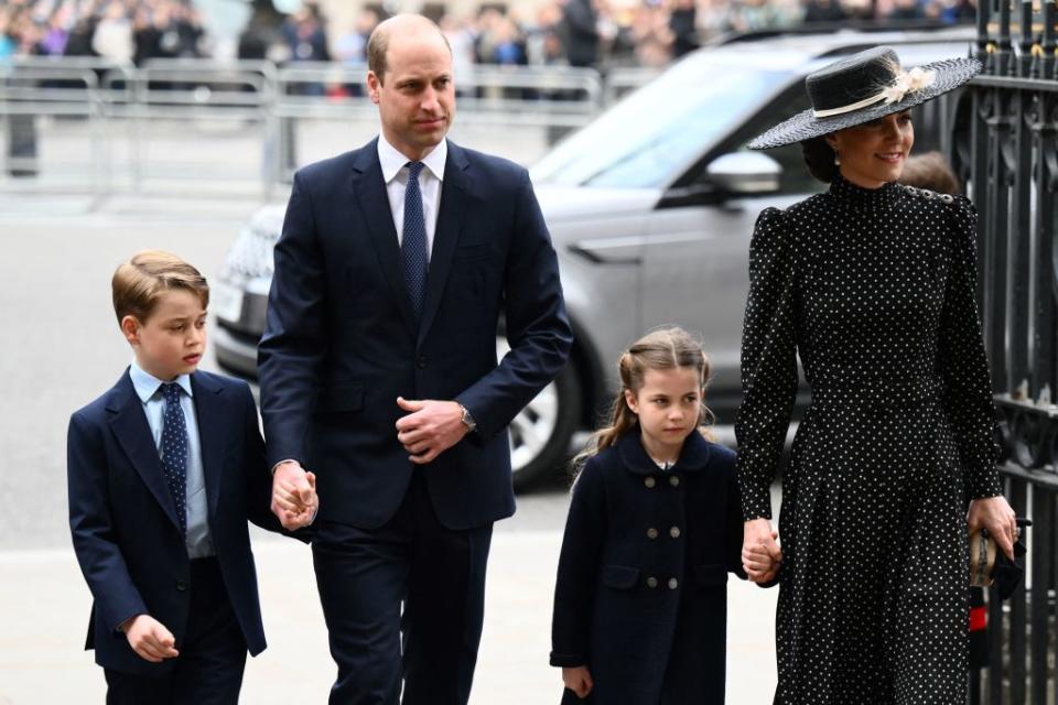 Prince George and Princess Charlotte arrived at the event holding their parents hands. (Photo by DANIEL LEAL/AFP via Getty Images)